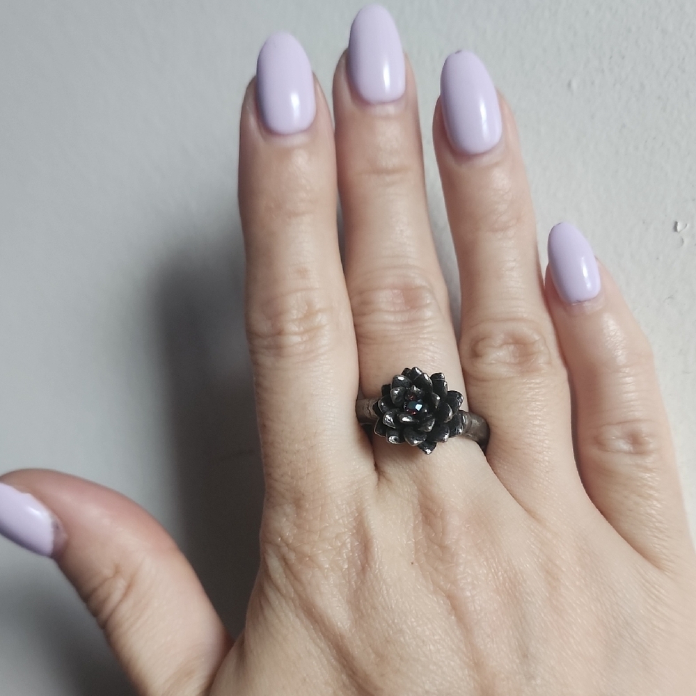 Martha Rotten adjustable succulent ring with crystal in middle.